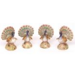 Set of four Continental painted porcelain menu holders formed as peacocks in display, two with