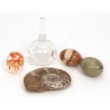 Group comprising a fossil shaped paperweight, two agate eggs, modern glass paperweight together with