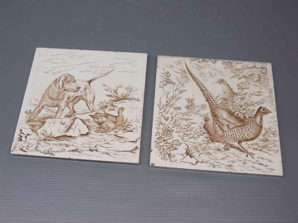 Pair of Victorian printed tiles,one with cock and hen pheasant,the other with gun dog and grouse,