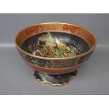 Carlton ware lustre decorated bowl in an Oriental style with black and red ground,raised gilded