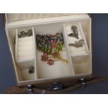 Suede cased jewellery box containing a quantity of mixed paste set costume jewellery,to include