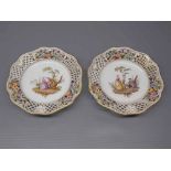 Pair of 19th century Meissen plates with painted figure centres,open work edge,painted floral