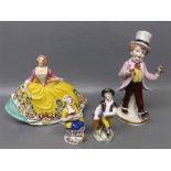 Continental model of a lady,in yellow and floral dress with interlocking Cs impressed to base,