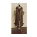 Copper cylindrical tea urn with ebonised handle and brass side handles,front tap,separate three-