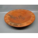 Large rust coloured shallow pottery bowl with leaf impressed border,14 1/2 ins diameter