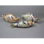 Group of three early 20th century Murano glass fish of varying sizes,mottled decoration,largest 13