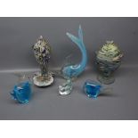 Three small Mantorp Swedish fish designed paperweights together with a further Murano glass wyvern