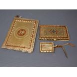 Group of three Indian style gilt cloth and silk lined items to include a wallet,two notepads (3)