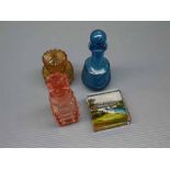 Group of three varying coloured and lidded scent bottles together with a further boxed square formed