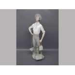 Lladro figure modelled as a fisherman,two baskets with rope handles,15ins tall