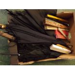 Box containing a quantity of mixed umbrellas,parasol,ebony and ivory inlaid elephant handle