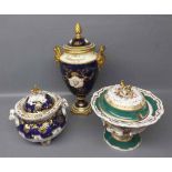 19th century Coalport urn style vase with blue ground,gilded designs,floral panel to front and