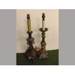 Two 20th century gilt metal and heavily cast electric lamps, one with triangular base supported on
