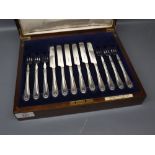 Mahogany cased set of six silver plated dessert knives and forks retailed by Carrington Co Ltd