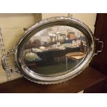 Good quality heavy oval silver plated tray with shaped edge and two stepped handles, raised on