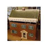 Mid-20th century wooden dolls house, the front with five opening windows and arched doorway, the