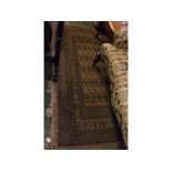 Modern Bokhara carpet, with repeating lozenge detail with multi gull border amongst a brown field,