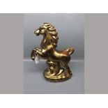 20th century gold lustre model of a leaping horse, 13ins high