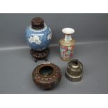 Oriental blossom decorated ginger jar with turned lid, raised on pierced openwork stand (a/f)