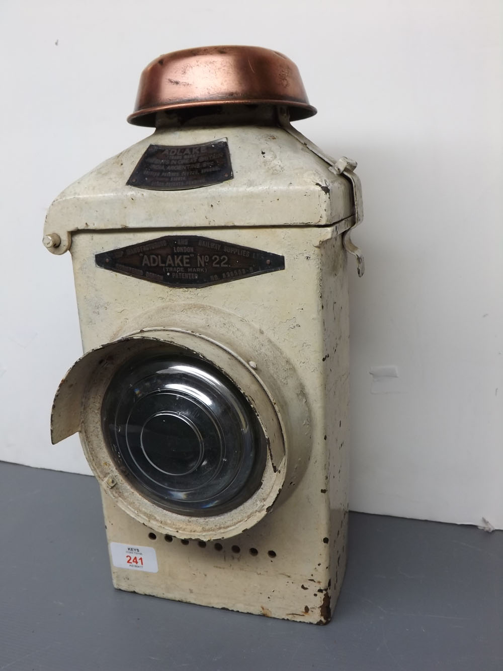 Adlake No 22 white painted railway lamp, number 826558-9, with bull's eye front glass and copper