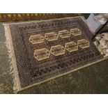 Modern carpet with multi gull border, with central interlocking lozenges with mainly grey ground,