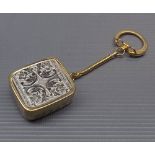 Modern Japanese made mechanical musical key fob, 1 1/2 ins square