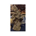 Composition rustic formed model of a wizard and spell book, 23ins tall