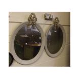 Pair of antiqued painted wood oval wall mirrors with ribbon tie tops, overall size 26ins x 19ins (2)