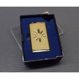 Brass and chromium cased stylised by Kigu of London lighter, with starburst style engraving, 2ins