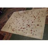 Modern cream ground wool carpet with floral blossom decoration, 67ins wide x 92ins long