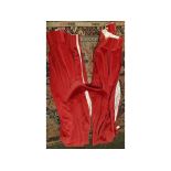 Pair of red velvet curtains and tie back, 44ins wide x 81ins drop (4)