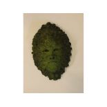 Composition green coloured head of the green man, decorated in acorn and oak leaves, 10ins x 15ins