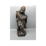 Early 20th century root carved figure of a Buddha, with carved detail and openwork stand, with