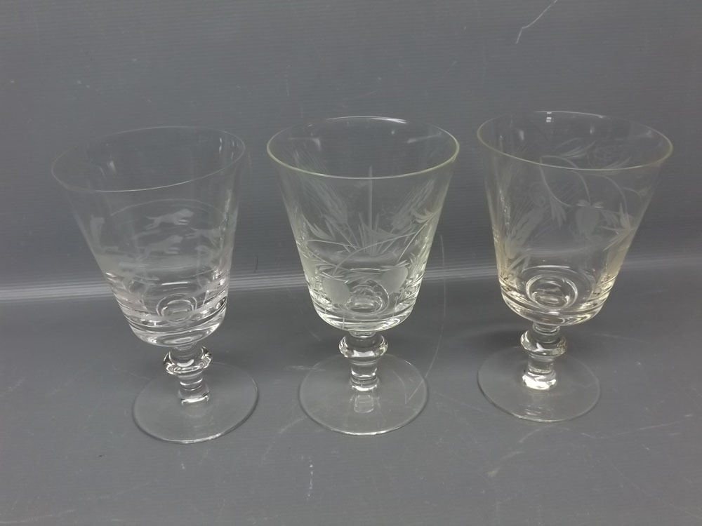 Pair of clear glass goblets with engraved barley detail, together with a further non-matching goblet