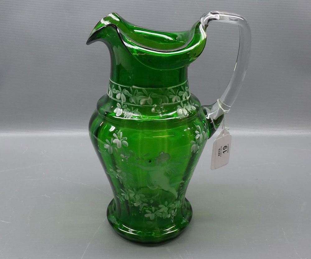 20th century green glass ewer decorated in the Mary Gregory manner, with clear glass shaped