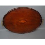 19th century mahogany two-handled tea tray, shell inlaid centre, the raised edge with damage,