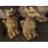 Pair of composition limestone coloured models of seated griffons, 10 x 20ins