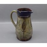 Royal Doulton green and blue stoneware jug, with Art Nouveau stylised decoration, lacking pewter