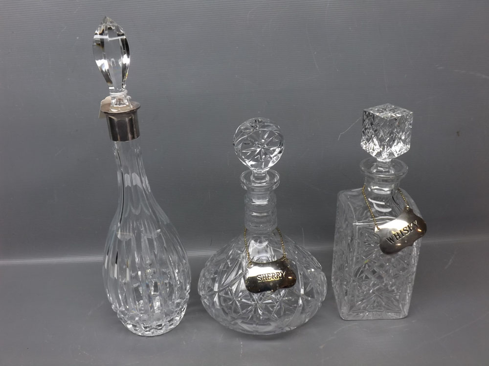 Mixed lot of three various clear glass decanters: square formed decanter with matching stopper and