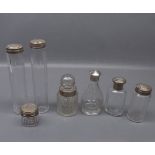 Group of six assorted late 19th/early 20th century silver mounted toiletry bottles and one other (7)