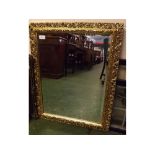 Modern rectangular giltwood wall mirror with pierced edge, bevelled glass, overall size 29ins x