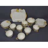 Paragon part tea service with yellow blossom design, comprising six cups, saucers and side plates,