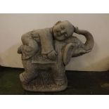 Composition model of an elephant with raised trunk, together with a laying young Buddha to top,