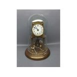 Early 20th century brass anniversary clock under glass dome, 11ins tall