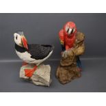 Model of a puffin standing on rocks, and a coloured model of a parrot by Animal Classics Unite