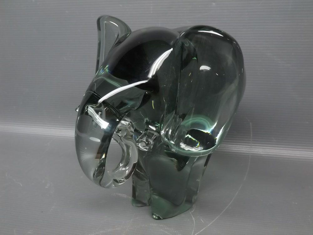 Heavy green glass paperweight, modelled as an elephant, 6 1/2 ins tall