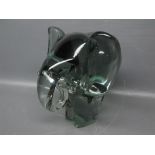 Heavy green glass paperweight, modelled as an elephant, 6 1/2 ins tall