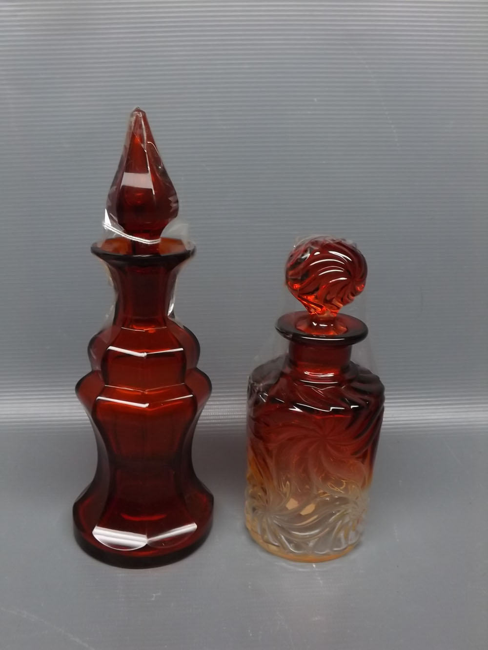 Victorian ruby glass scent bottle and stopper, of waisted and panelled circular form, 8 1/2 ins