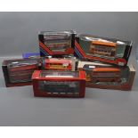 Group of 11 late 20th century boxed die-cast buses by various makers