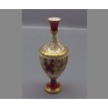 19th century hand painted Coalport vase, with shaped red panels with gilded design, 6 1/2 ins tall